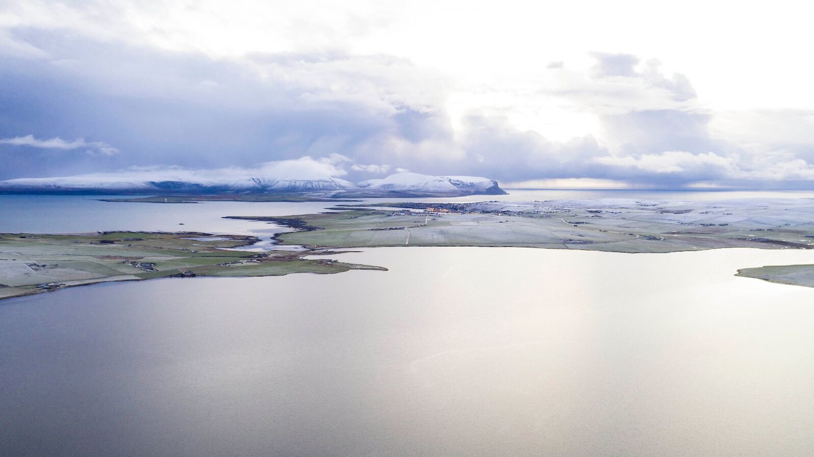 View over the Stenness Loch towards Stromness and Hoy - image by Andras Farkas