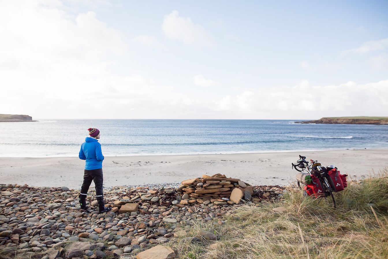 Taking a break from cycling at the Bay of Skaill, Orkney