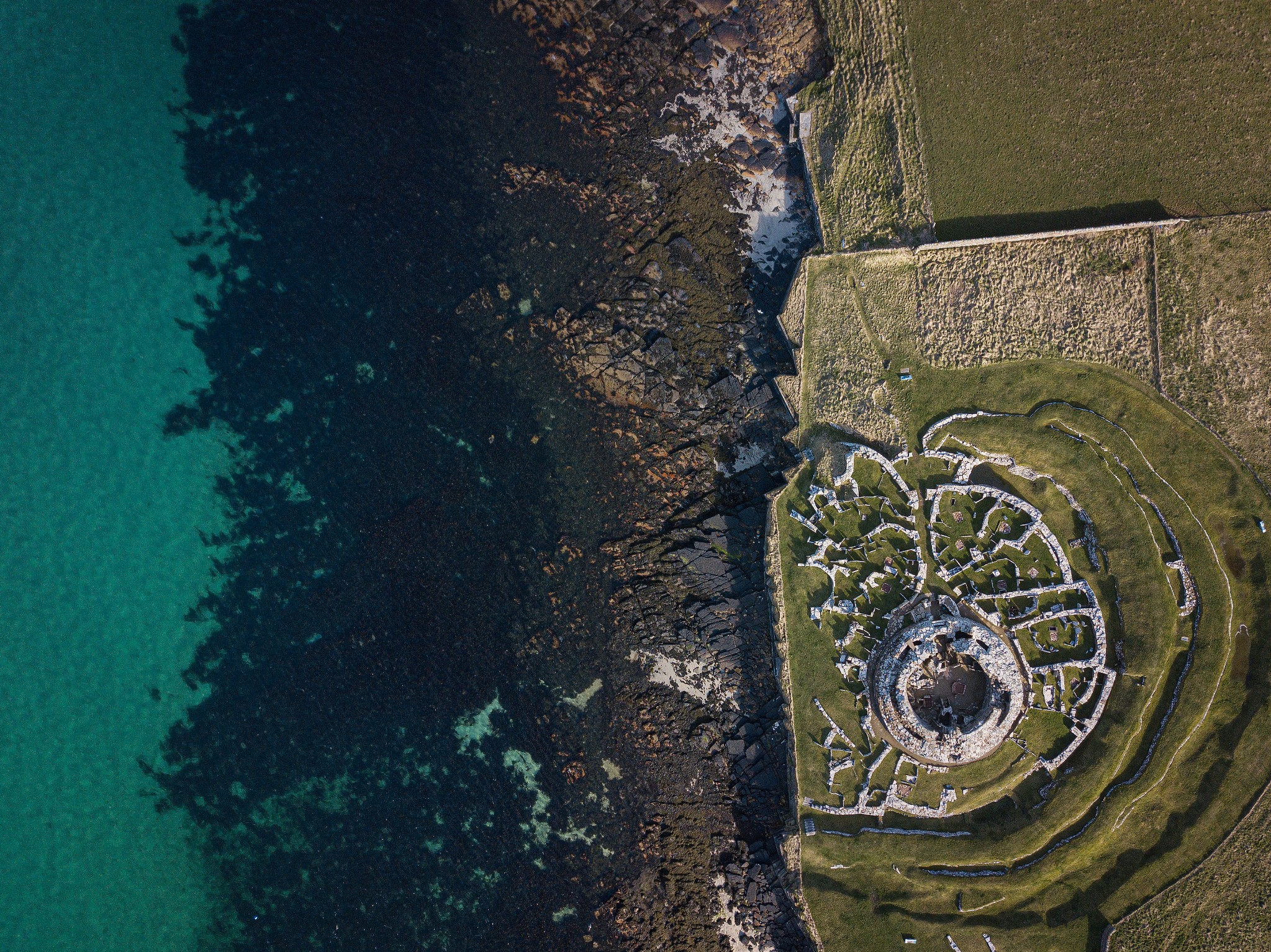 Aerial view over the Broch of Gurness, Orkney - image by John Stoddard