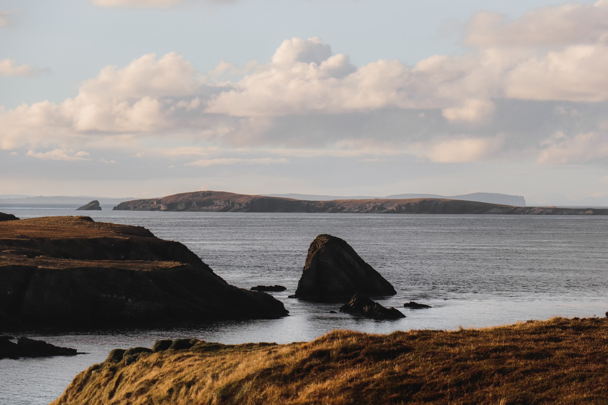 Looking towards the uninhabited island of Swona, with the Scottish mainland beyond.