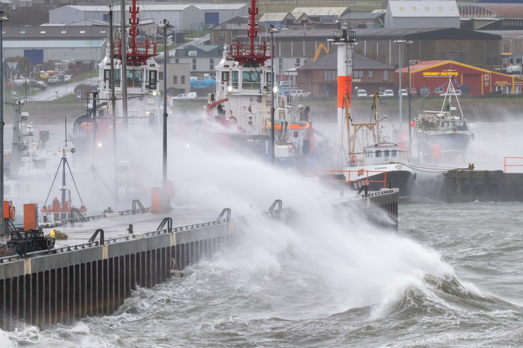 Waves overtopping the pier in Kirkwall - images by Raymond Besant
