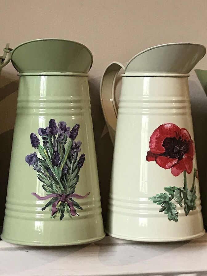 Hand painted metal jugs