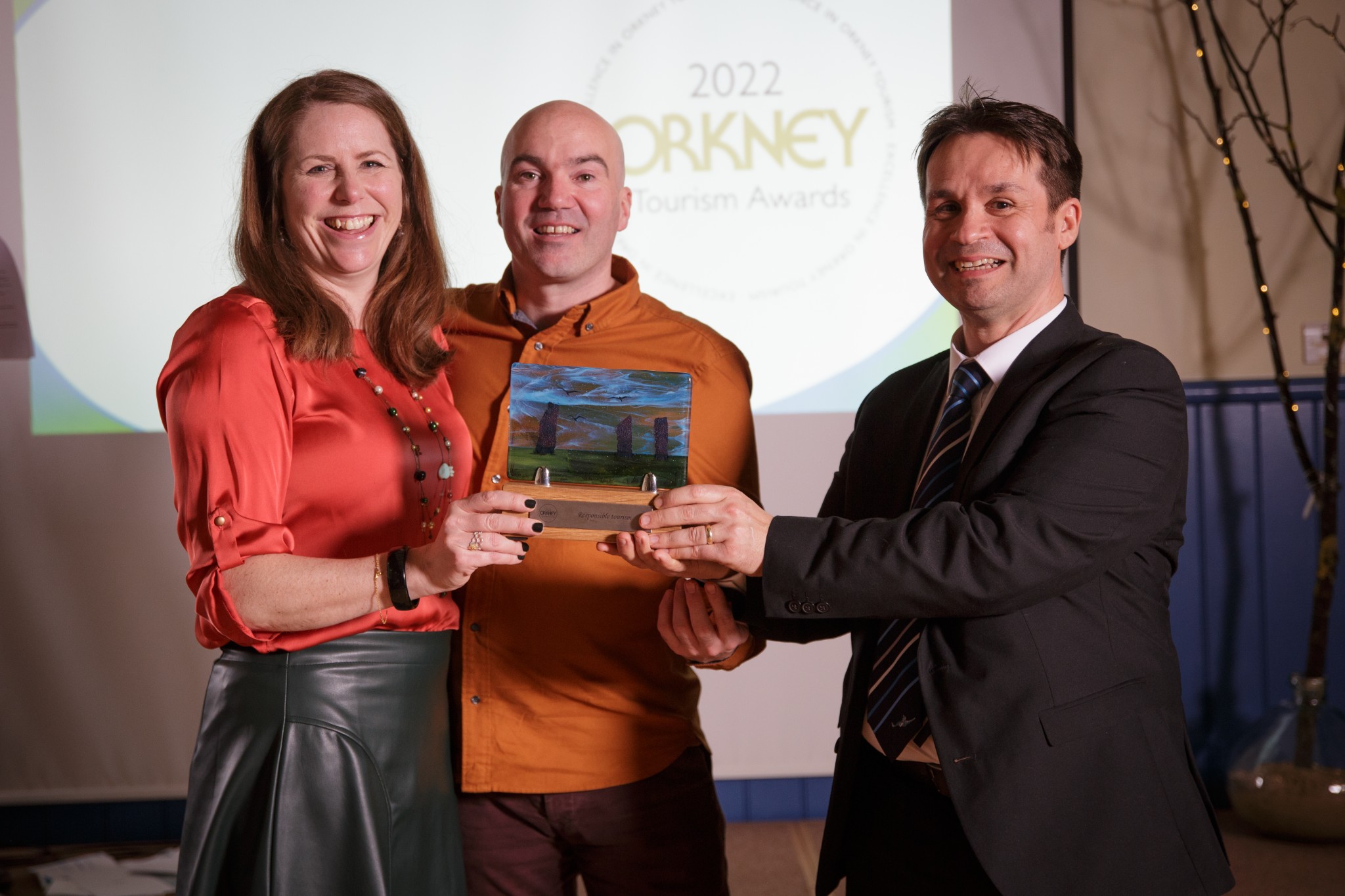 Jane and Paul Hudd receiving the Responsible Tourism Award from NorthLink Ferries' Magnus Dixon at the Orkney Tourism Awards