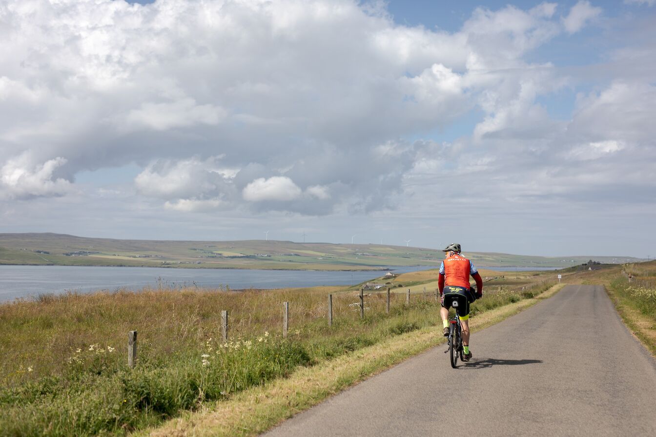 Cycling on the Rousay road, Rousay, Orkney