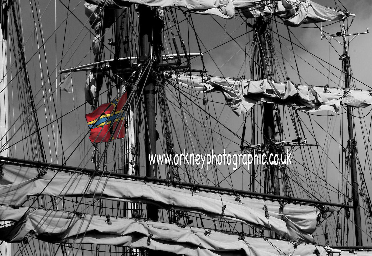 The Orkny Flag proudly displayed on a tall ship mast during the Tall Ships visit to Orkney pic orkney photographic